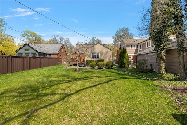 view of yard with fence and a residential view