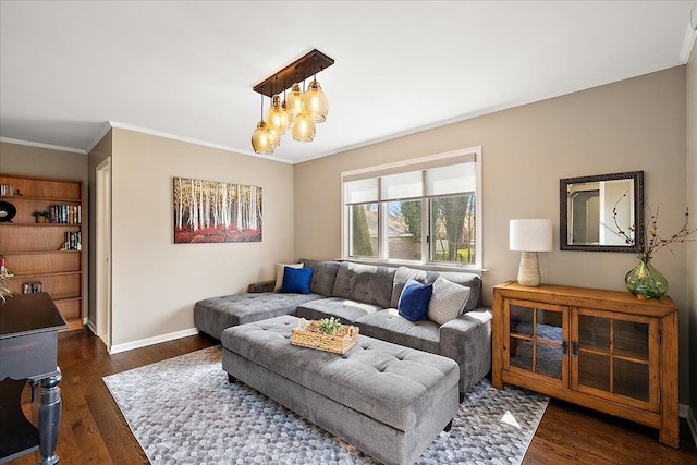 living room with crown molding, a chandelier, baseboards, and dark wood finished floors