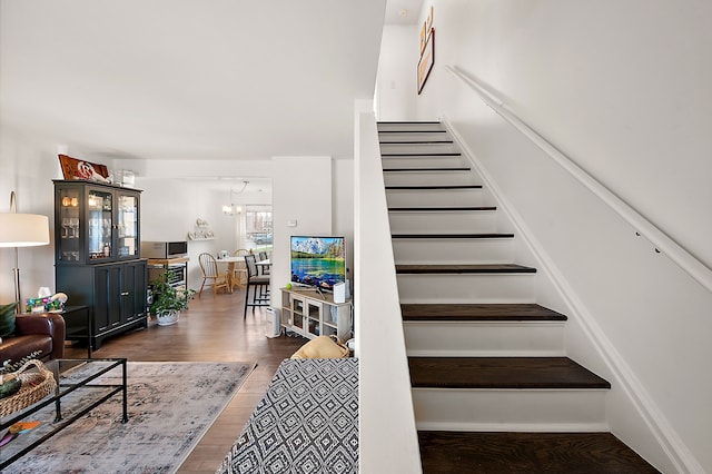 staircase featuring wood finished floors