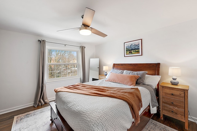bedroom featuring baseboards, ceiling fan, and wood finished floors