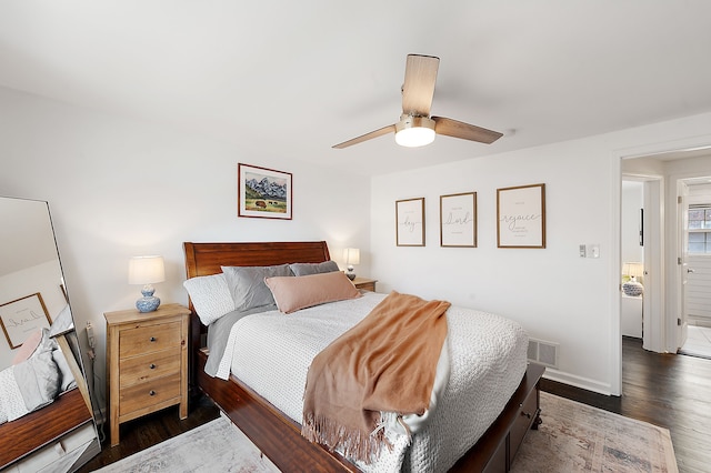 bedroom with baseboards, a ceiling fan, dark wood finished floors, and visible vents