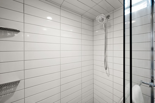 full bath with a shower stall