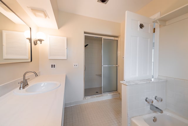 full bath with vanity, a shower stall, and a bath