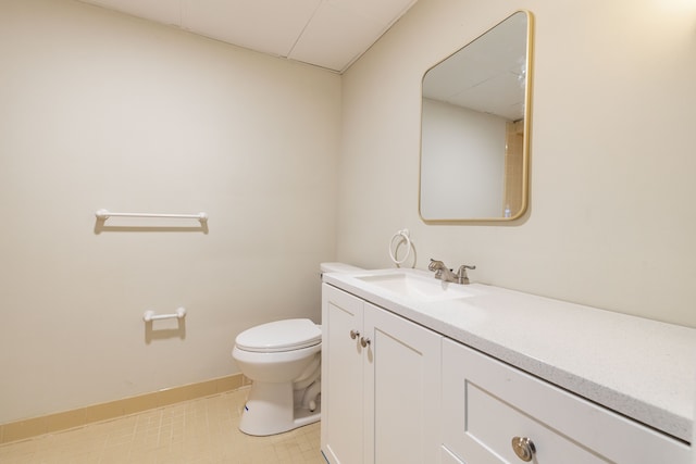 bathroom featuring toilet and vanity