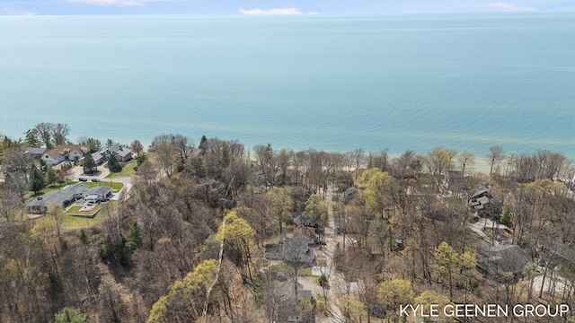 drone / aerial view with a residential view and a water view