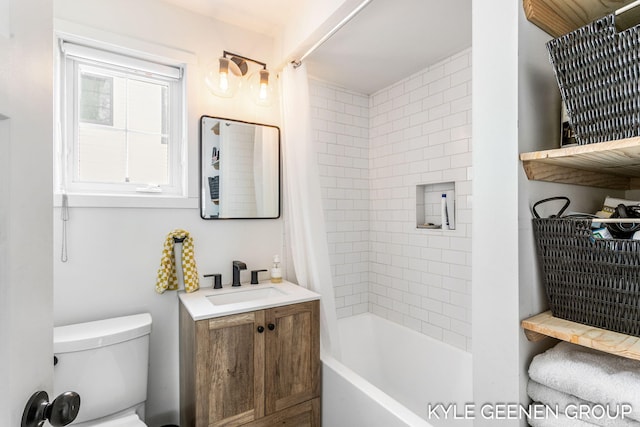 bathroom with vanity, shower / bath combination with curtain, and toilet
