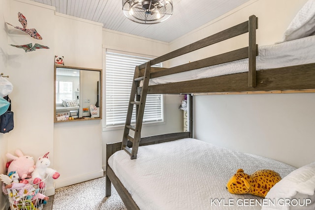 carpeted bedroom with baseboards