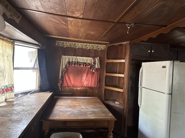 dining area featuring wood ceiling