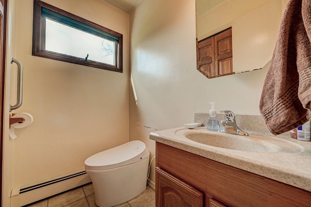 bathroom featuring vanity, tile patterned flooring, a baseboard heating unit, and toilet
