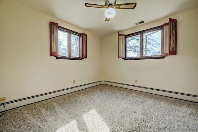 carpeted empty room featuring visible vents, ceiling fan, and a wealth of natural light