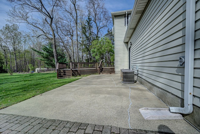 view of patio featuring a wooden deck and cooling unit