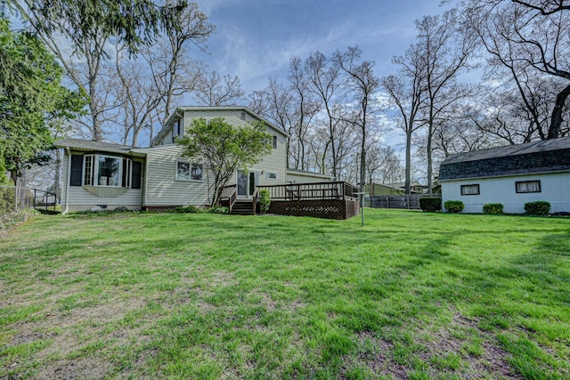 view of yard with fence and a wooden deck