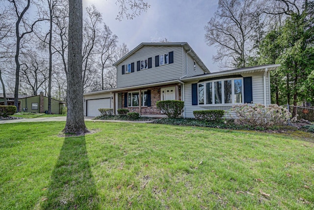 view of front of home with concrete driveway, brick siding, a front yard, and a garage