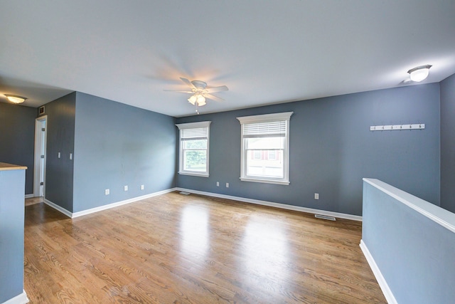 3067 Oakridge, Lake Orion, MI 48360 - spare room with ceiling fan, wood finished floors, and baseboards