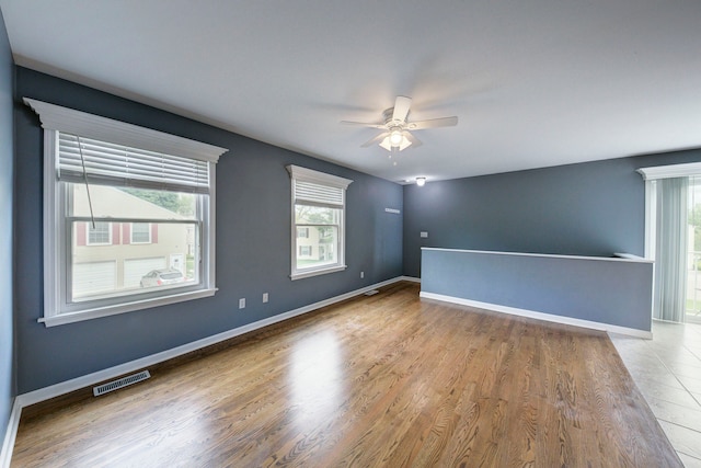 3067 Oakridge, Lake Orion, MI 48360 - spare room featuring a ceiling fan, plenty of natural light, and wood finished floors