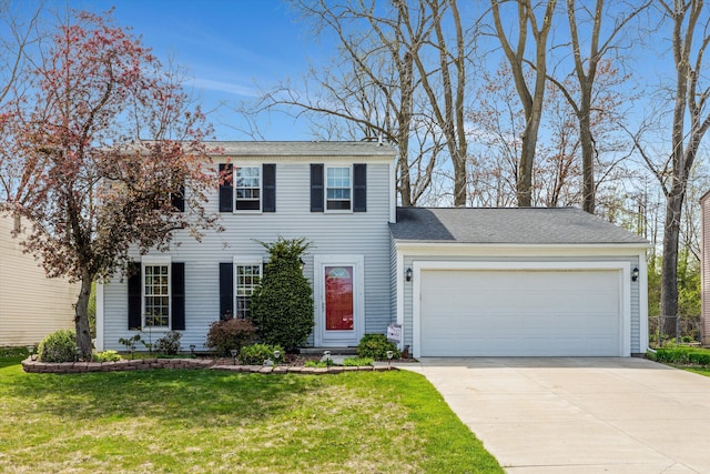 colonial-style house with an attached garage, a front yard, and concrete driveway