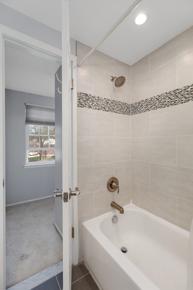 full bathroom with baseboards and shower / washtub combination