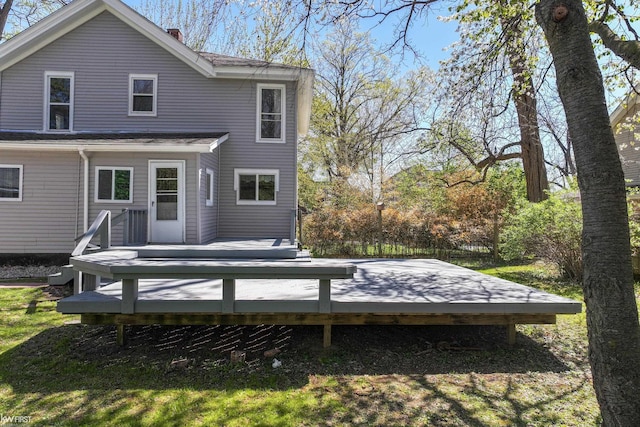 back of property with a deck