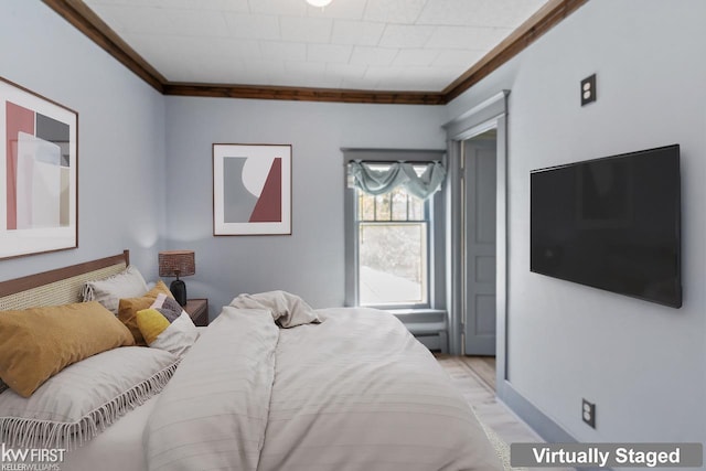 bedroom with crown molding