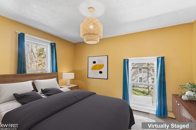 bedroom with a baseboard radiator