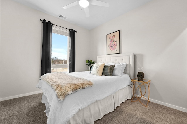bedroom with ceiling fan, baseboards, visible vents, and dark carpet