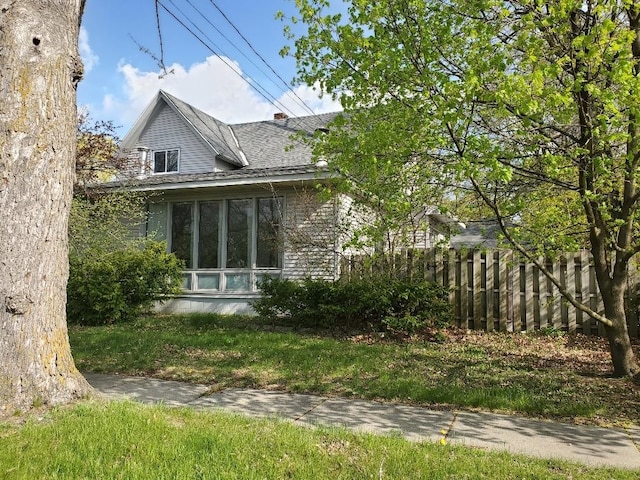 429 S Arnold, Mount Pleasant, MI 48858 - view of side of home with fence and roof with shingles