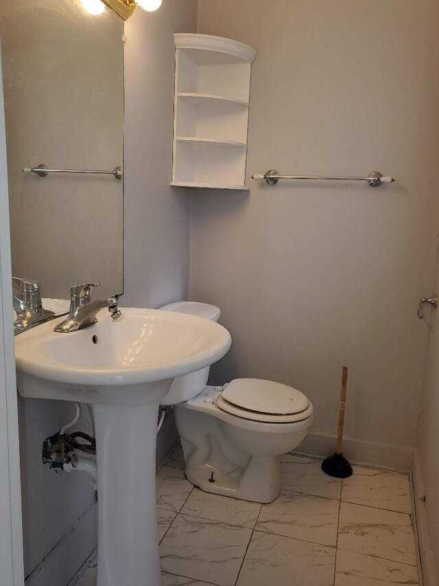 429 S Arnold, Mount Pleasant, MI 48858 - bathroom with toilet and marble finish floor