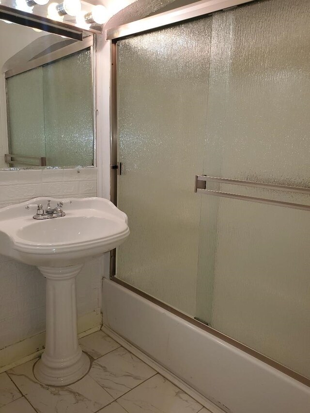 429 S Arnold, Mount Pleasant, MI 48858 - bathroom with shower / bath combination with glass door and marble finish floor