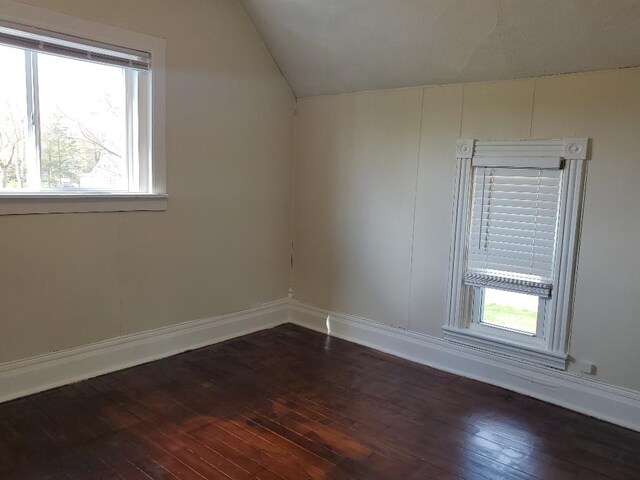 429 S Arnold, Mount Pleasant, MI 48858 - interior space featuring baseboards, dark wood finished floors, and lofted ceiling