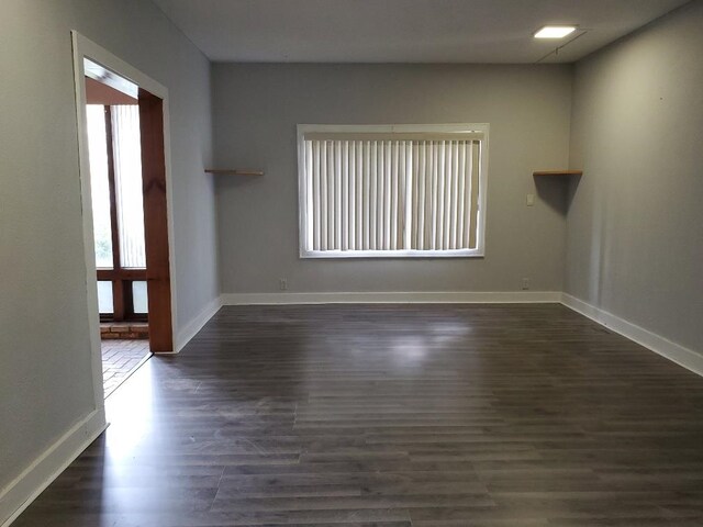 429 S Arnold, Mount Pleasant, MI 48858 - empty room featuring baseboards and dark wood-style floors