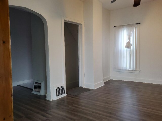 429 S Arnold, Mount Pleasant, MI 48858 - empty room featuring dark wood-style flooring, ceiling fan, visible vents, and baseboards