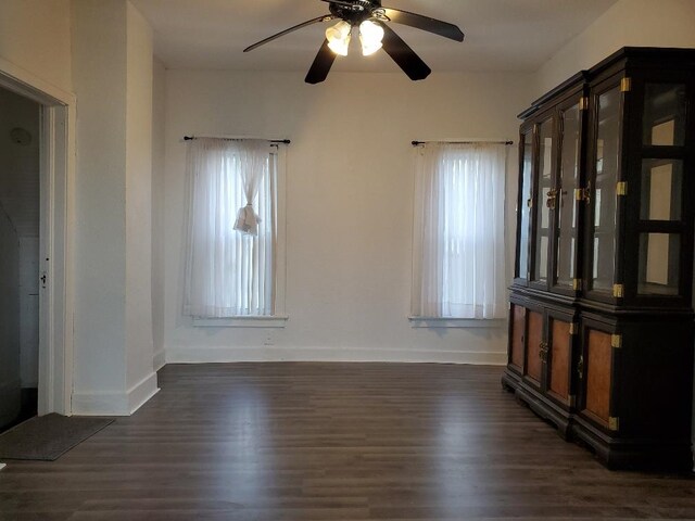 429 S Arnold, Mount Pleasant, MI 48858 - empty room with baseboards, a ceiling fan, and dark wood finished floors