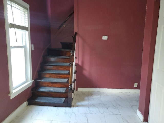 429 S Arnold, Mount Pleasant, MI 48858 - stairway with baseboards, a wealth of natural light, and marble finish floor