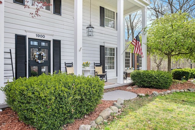 property entrance featuring covered porch