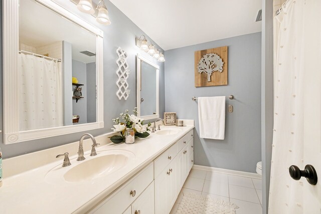 full bath with toilet, tile patterned floors, visible vents, and a sink