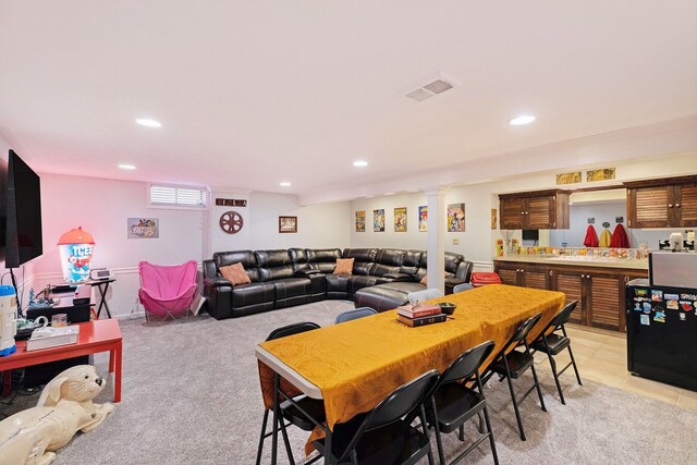 dining room with visible vents, recessed lighting, decorative columns, and light colored carpet