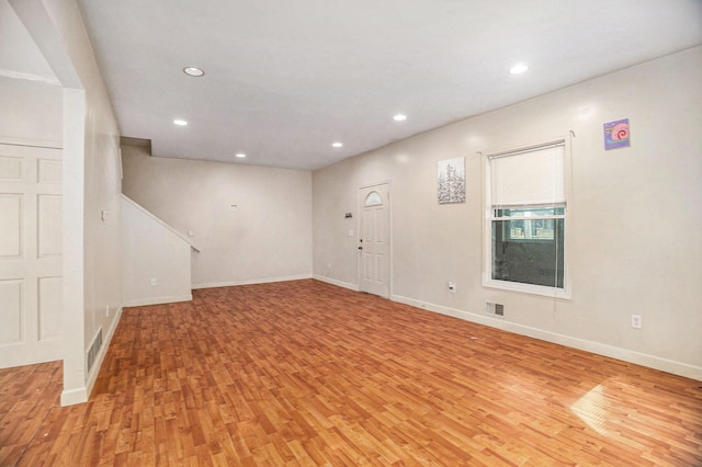 interior space with recessed lighting, baseboards, and light wood-type flooring