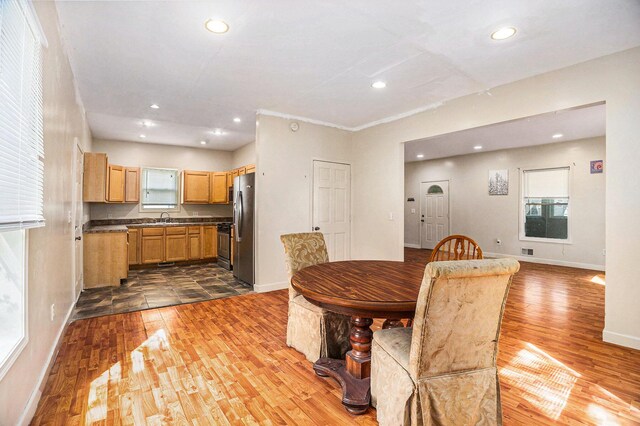 dining room featuring recessed lighting, baseboards, visible vents, and wood finished floors