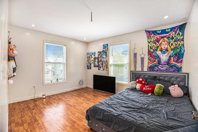 bedroom featuring recessed lighting, baseboards, and wood finished floors
