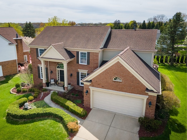 1699 Devonwood Dr, Rochester Hills, MI 48306 - view of front of house featuring brick siding, a garage, a front yard, and concrete driveway