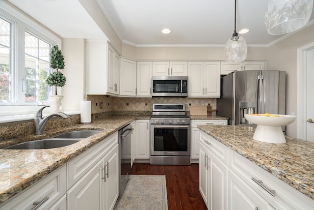 1699 Devonwood Dr, Rochester Hills, MI 48306 - kitchen featuring white cabinets, stainless steel appliances, a sink, and tasteful backsplash