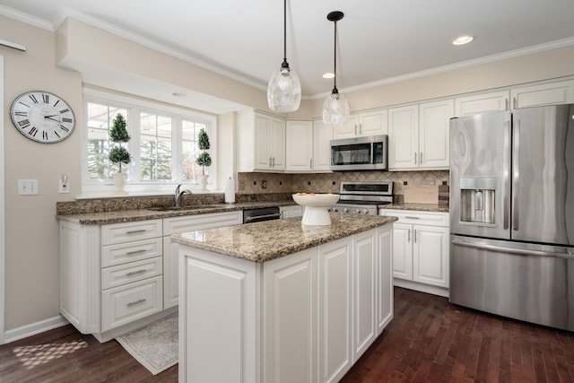 1699 Devonwood Dr, Rochester Hills, MI 48306 - kitchen with appliances with stainless steel finishes, a sink, white cabinetry, dark wood-type flooring, and ornamental molding