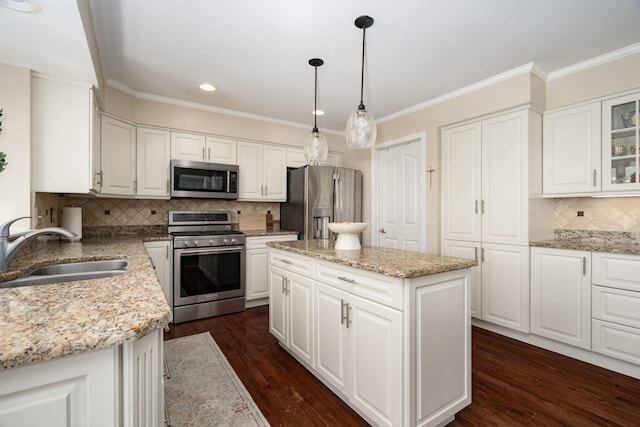 1699 Devonwood Dr, Rochester Hills, MI 48306 - kitchen featuring backsplash, dark wood finished floors, a sink, stainless steel appliances, and white cabinetry