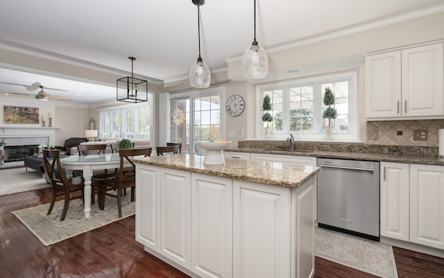 1699 Devonwood Dr, Rochester Hills, MI 48306 - kitchen featuring stainless steel dishwasher, a sink, and ornamental molding