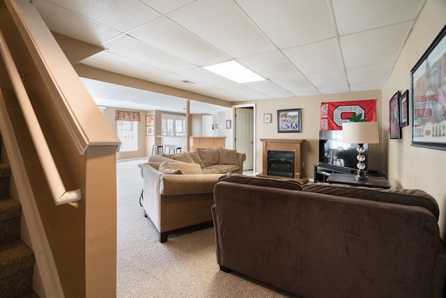 1699 Devonwood Dr, Rochester Hills, MI 48306 - living area featuring carpet floors, stairs, a glass covered fireplace, and a drop ceiling