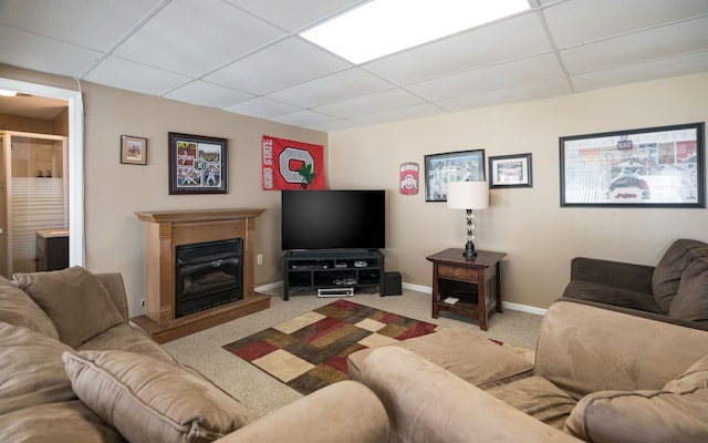 1699 Devonwood Dr, Rochester Hills, MI 48306 - carpeted living area featuring a glass covered fireplace, baseboards, and a drop ceiling