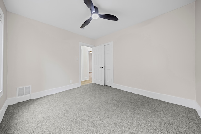 15866 Woodingham Dr, Detroit, MI 48238 - empty room featuring carpet floors, ceiling fan, visible vents, and baseboards