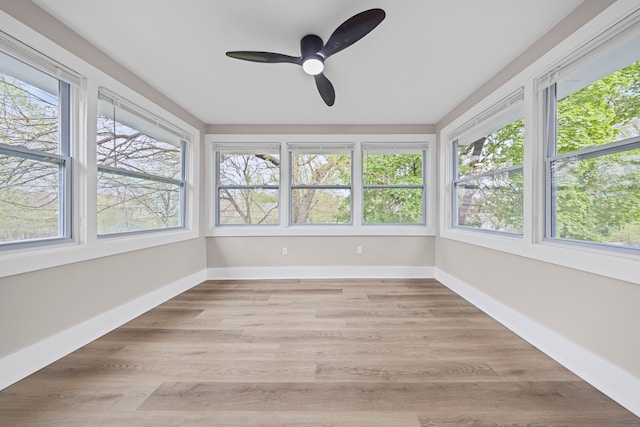15866 Woodingham Dr, Detroit, MI 48238 - unfurnished sunroom featuring baseboards and wood finished floors