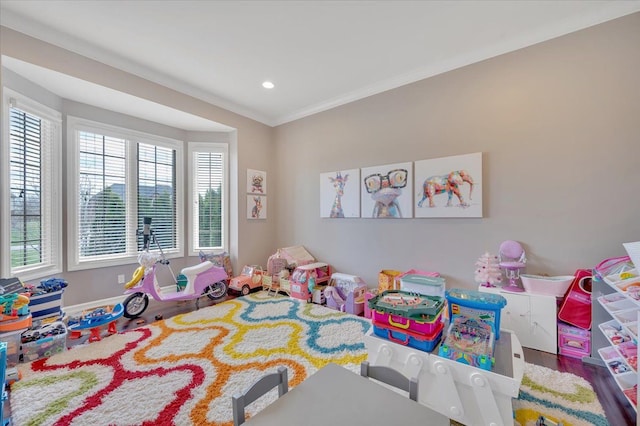 playroom featuring baseboards, ornamental molding, recessed lighting, and wood finished floors