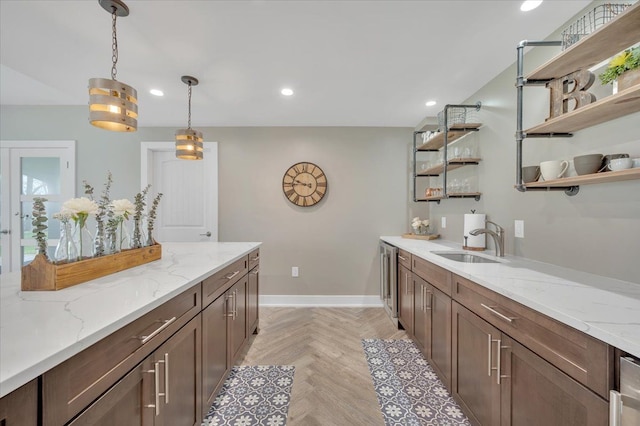 bar with a sink, baseboards, hanging light fixtures, and recessed lighting